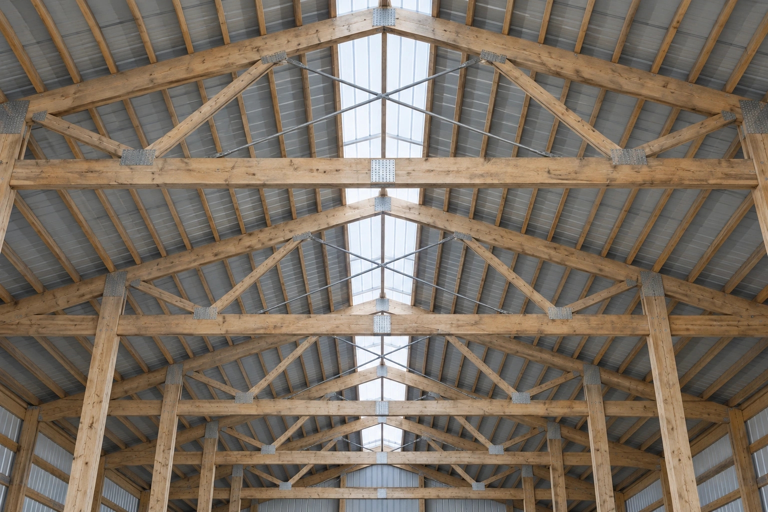 Large agricultural pole barn with open sliding doors on flat harvested farmland near Fargo, North Dakota